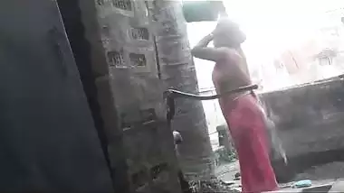 my maid takinghower at backyard